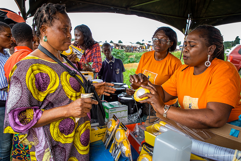 Solar Sister Entrepreneur Akeri Ukpong at a product fair held by entrepreneurs on market day to showcase products to potential customers. Uyo, Akwa Ibom, Nigeria.